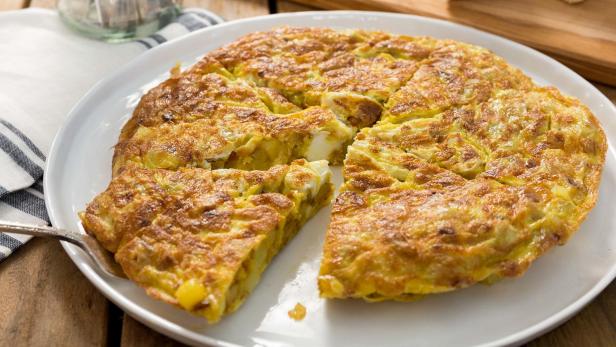 Thick slice of a round potato omelet